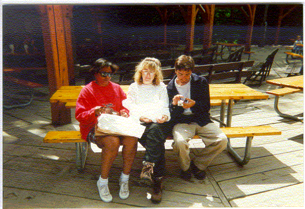 Cheryl, Susan,  and Juan checking out their souvenirs